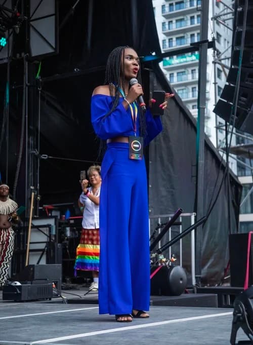 Julie speaking on stage