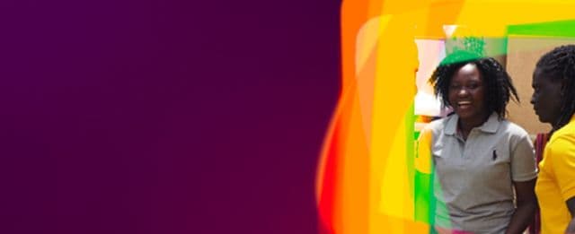 Banner featuring two smiling people on the right side, overlaid with bright rainbow-colored shapes on a deep purple background.