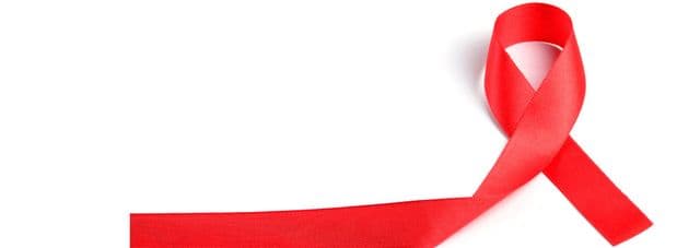 Red awareness ribbon on a white background.