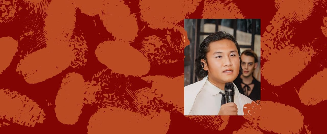 Person speaking into microphone with red and orange thumbprint background.