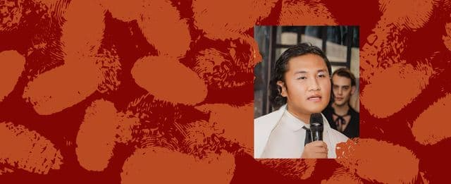 Person speaking into microphone with red and orange thumbprint background.