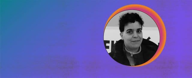 Black-and-white portrait of a person against a blue and purple background.