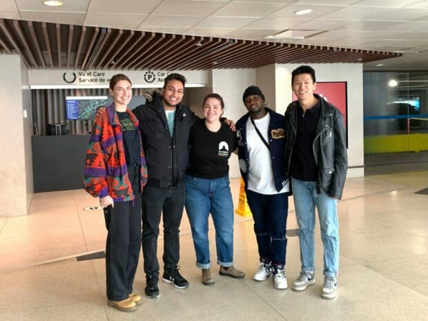 Group of people standing in airport.